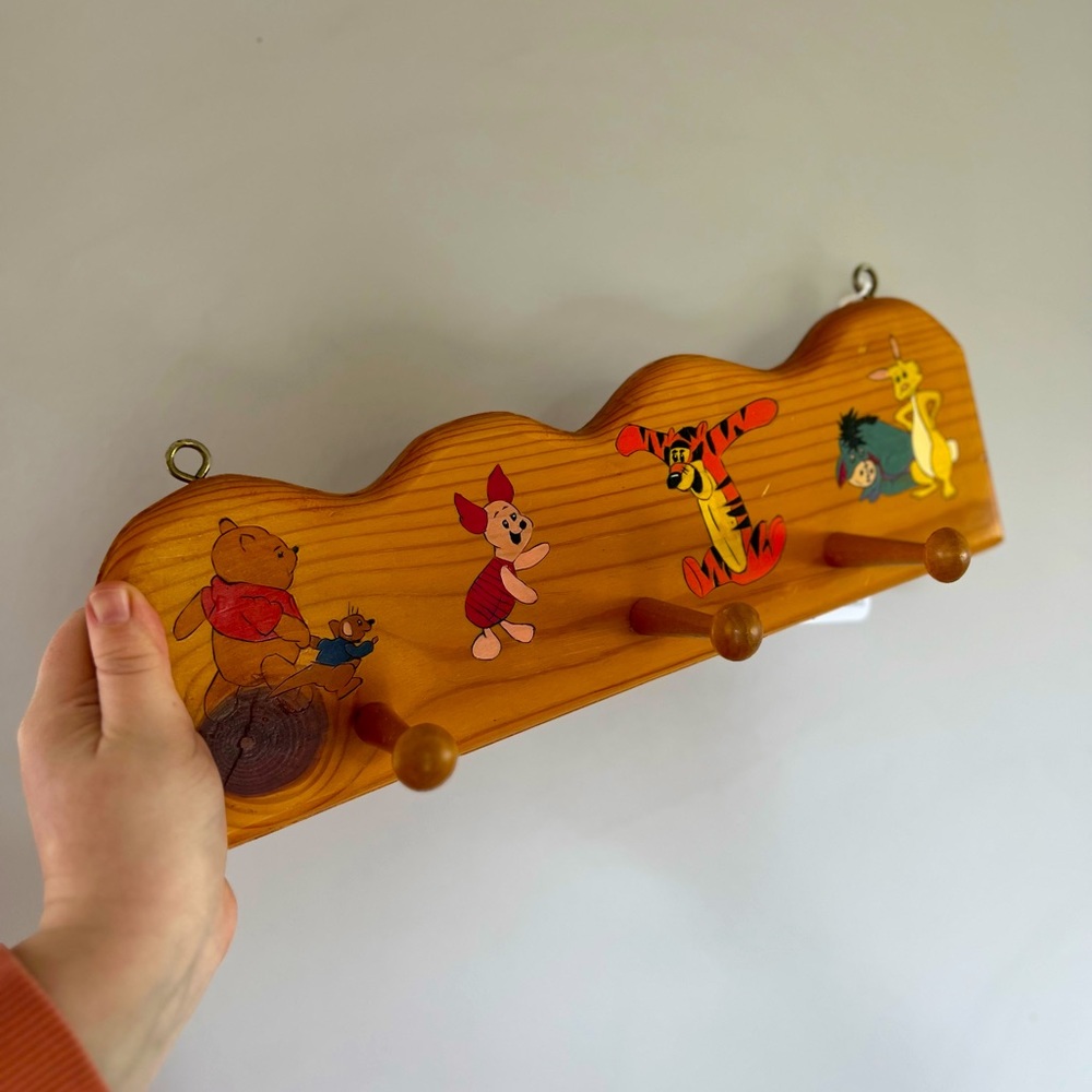 wood clothing peg rack with winnie the pooh characters painted